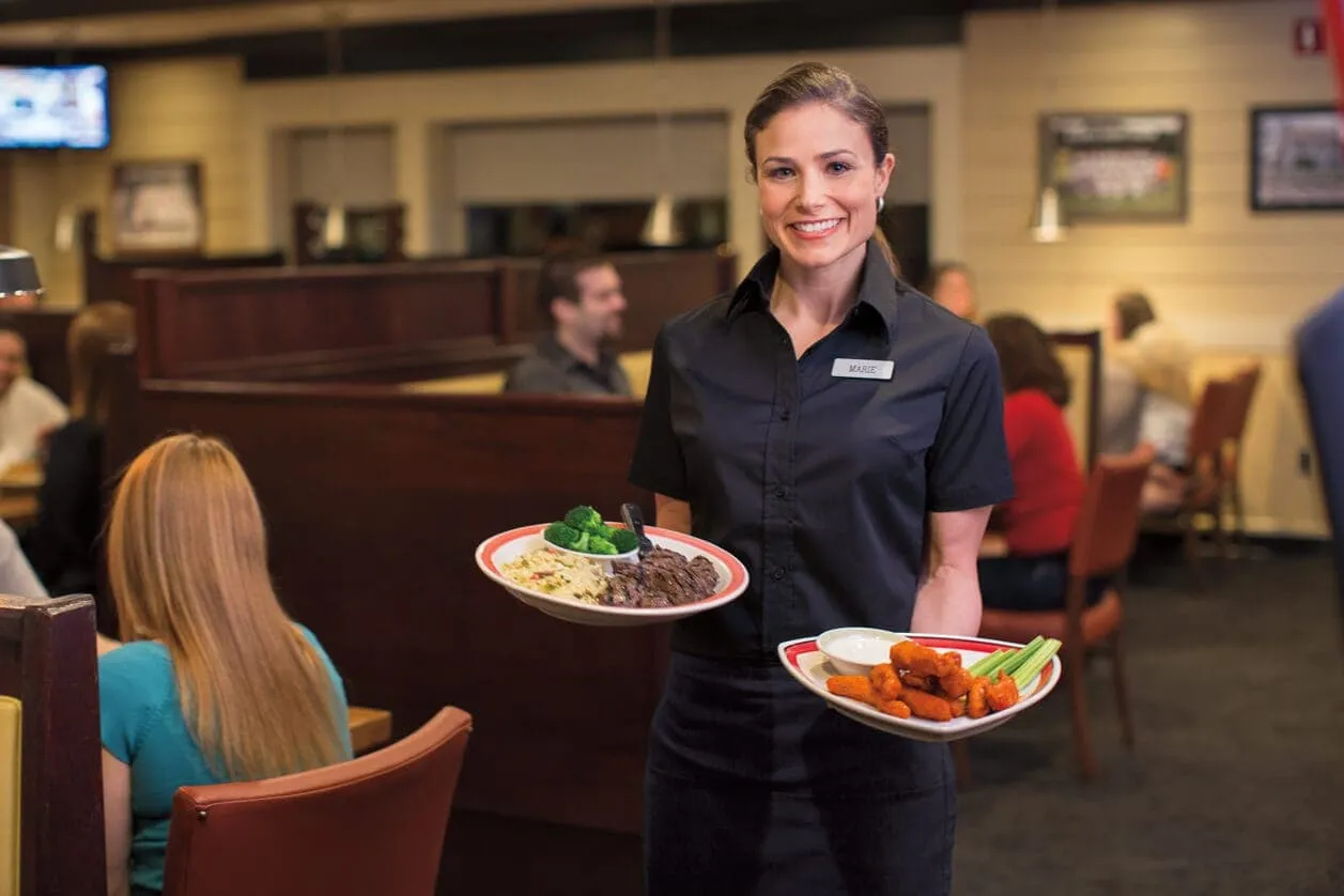 Woman holding plates of food